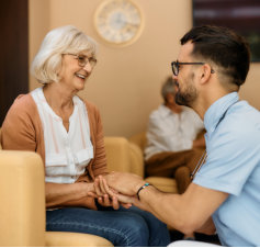 caretaker and elderly woman talking